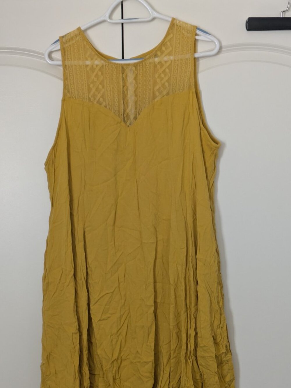 Yellow sleeveless Torrid dress with lace detailing and asymmetrical hem, size 3